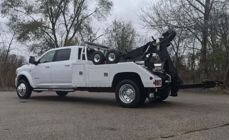 Burlington wrecker equipment securing damaged vehicle
